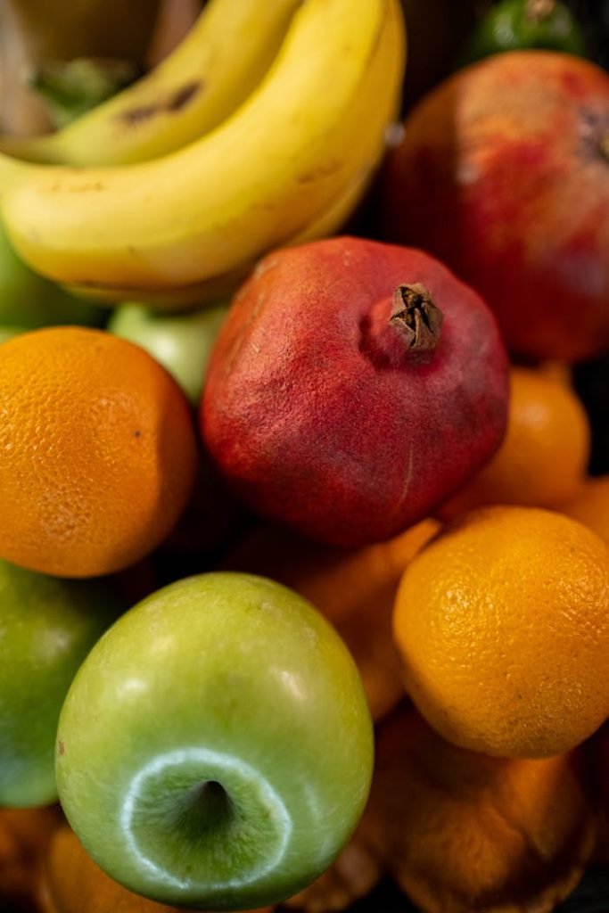 close-up-photo-of-assorted-fruits-8426698 Colorful assortment of fresh fruits including bananas, apples, and oranges.